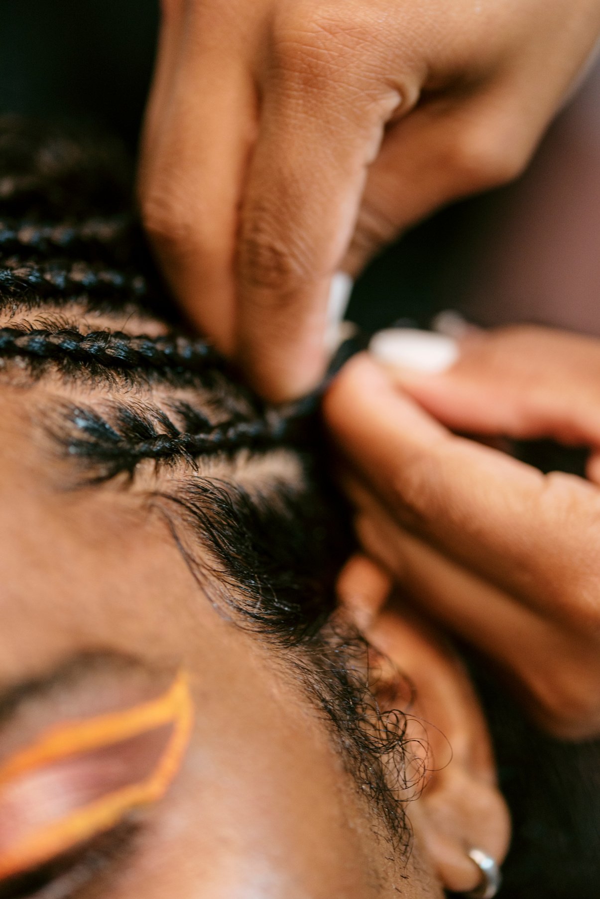 Man with Curly Hair Getting Braids